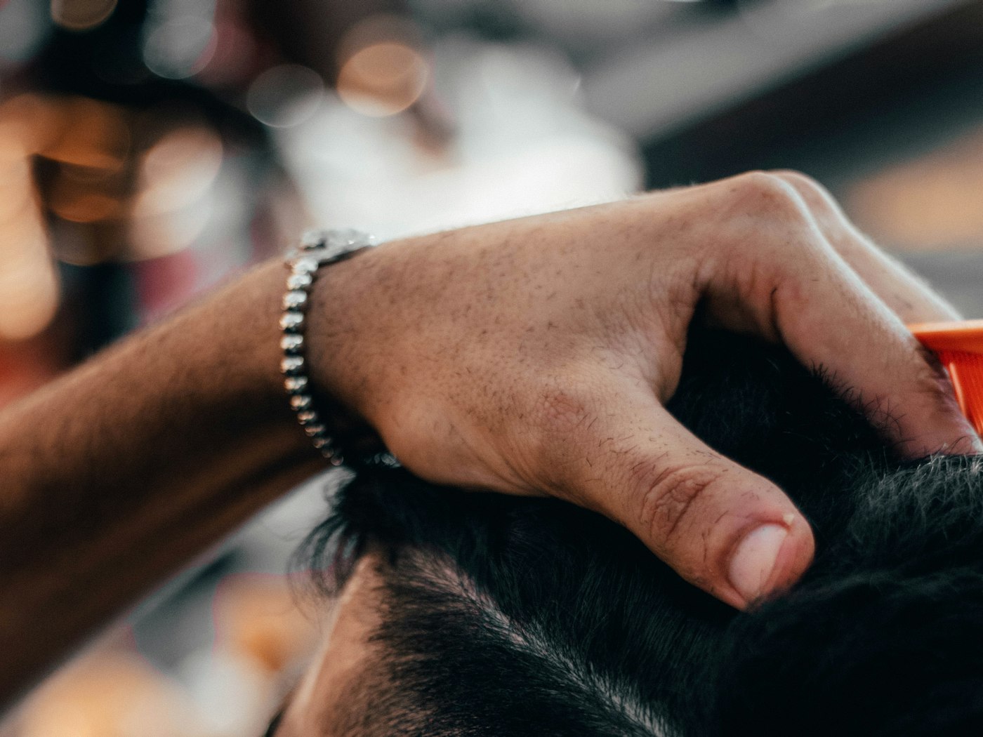 A fade being blended with clippers over comb