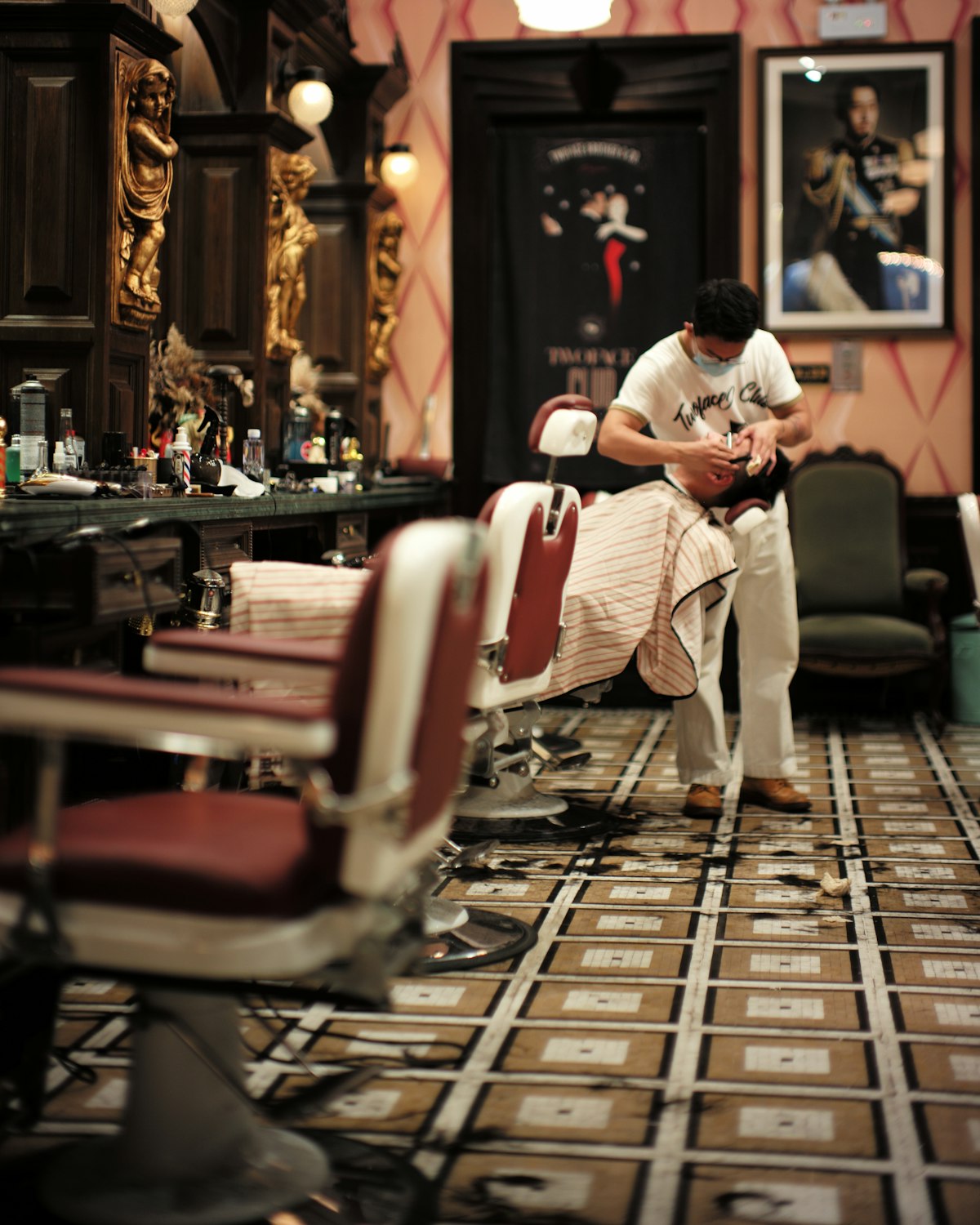 A barber working through a full sitting at the chair