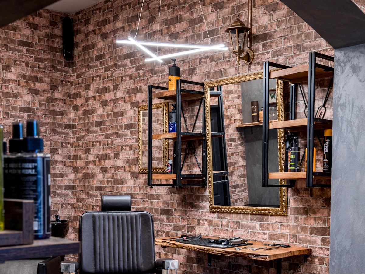 The brick wall and wooden shelving at the back of the shop